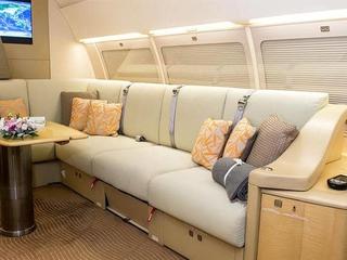 Comlux ACJ319 9H-LIV cabin interior, close up on sofa