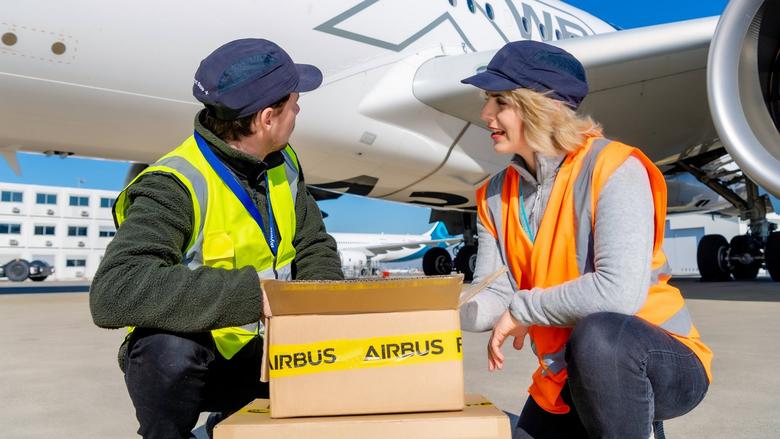 Airbus people on the tarmac close to an aircraft