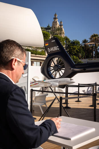 Sylvain Mariat drawing an Helicopter (ACH) at Monaco Yacht Show